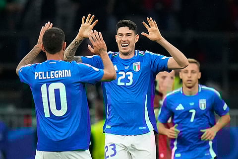 Italy players celebrate team's goal against Albania